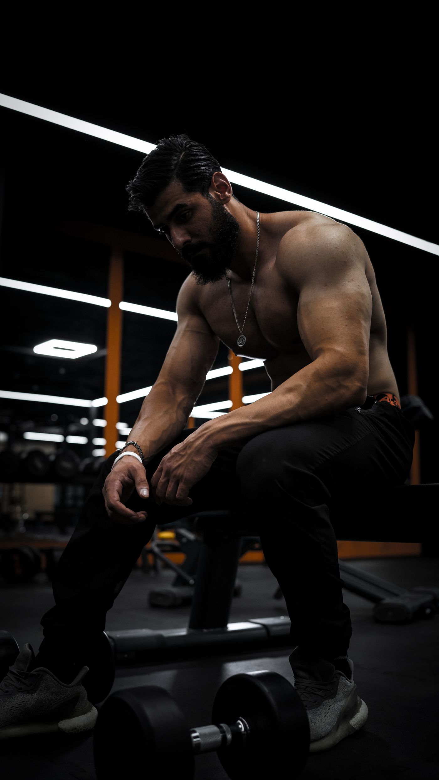 Athlete training in a dark gym